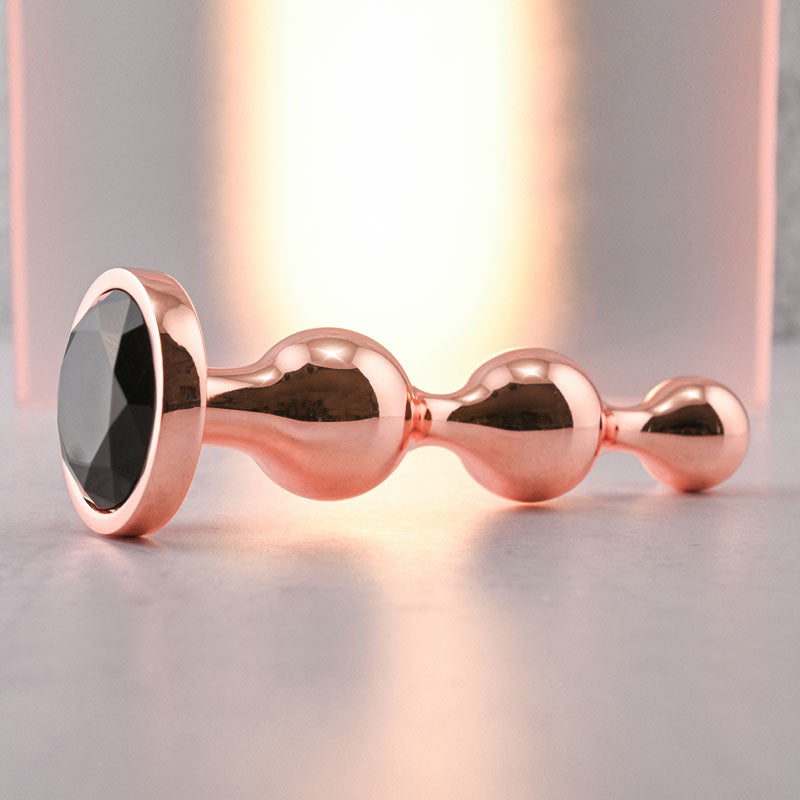 Gender X GOLD DIGGER Large - Rose Gold Large Butt Plug with Black Gem Base